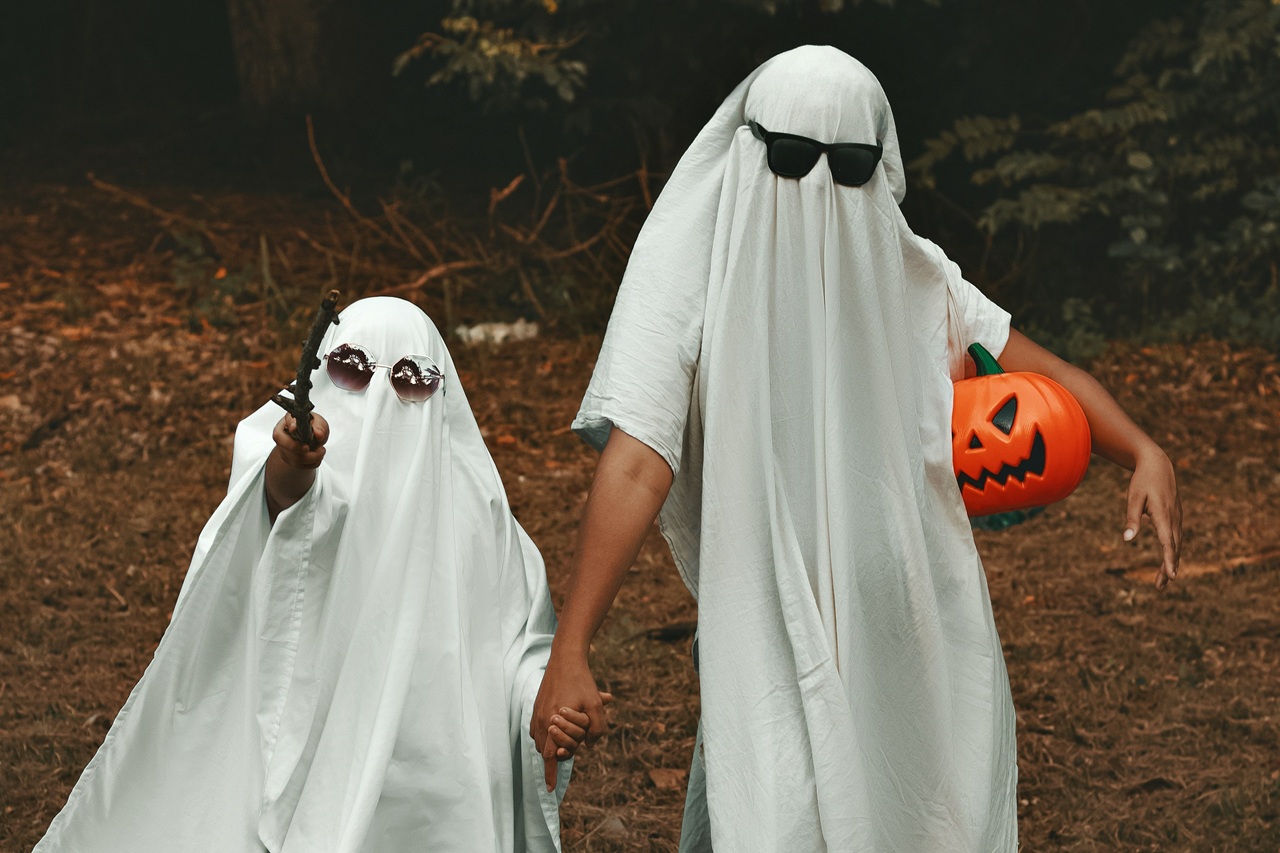 Children in sheets pretending to be ghosts.