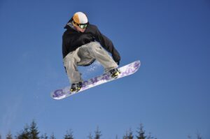 A snowboarder mid-jump.
