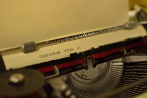 A page in a typewriter bearing the words, "Curriculum Vitae di"